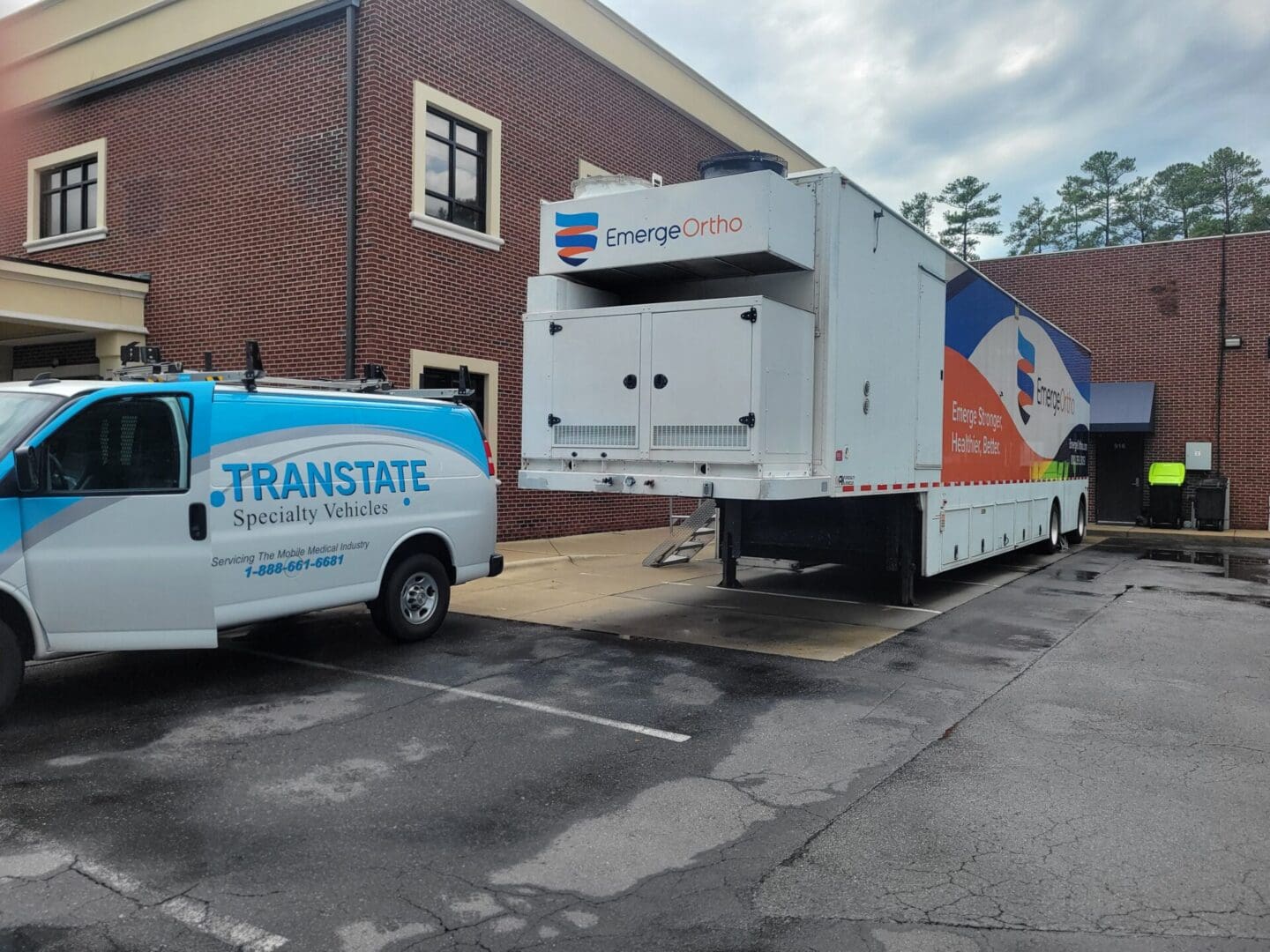 A truck is parked in front of a building.